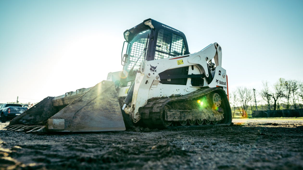 An excavator clearing land