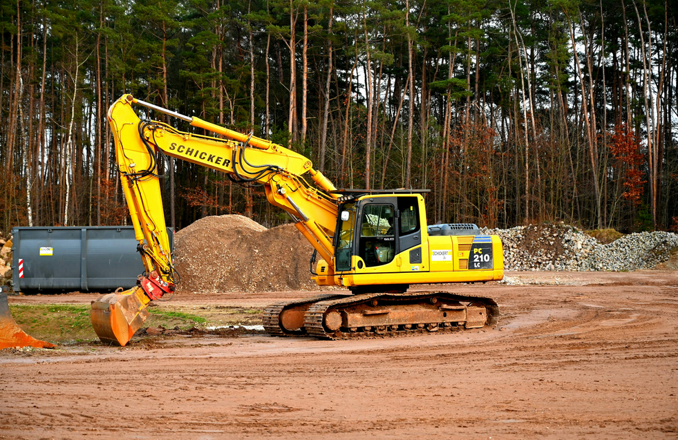 An excavator for leveling the ground