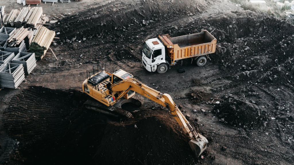 An excavator and a truck